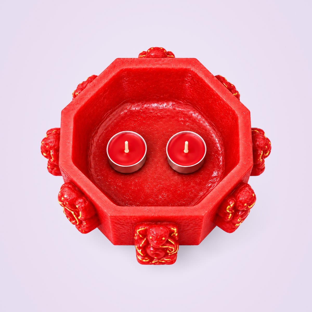 Red Ashtavinayak holder from above with two tealights
