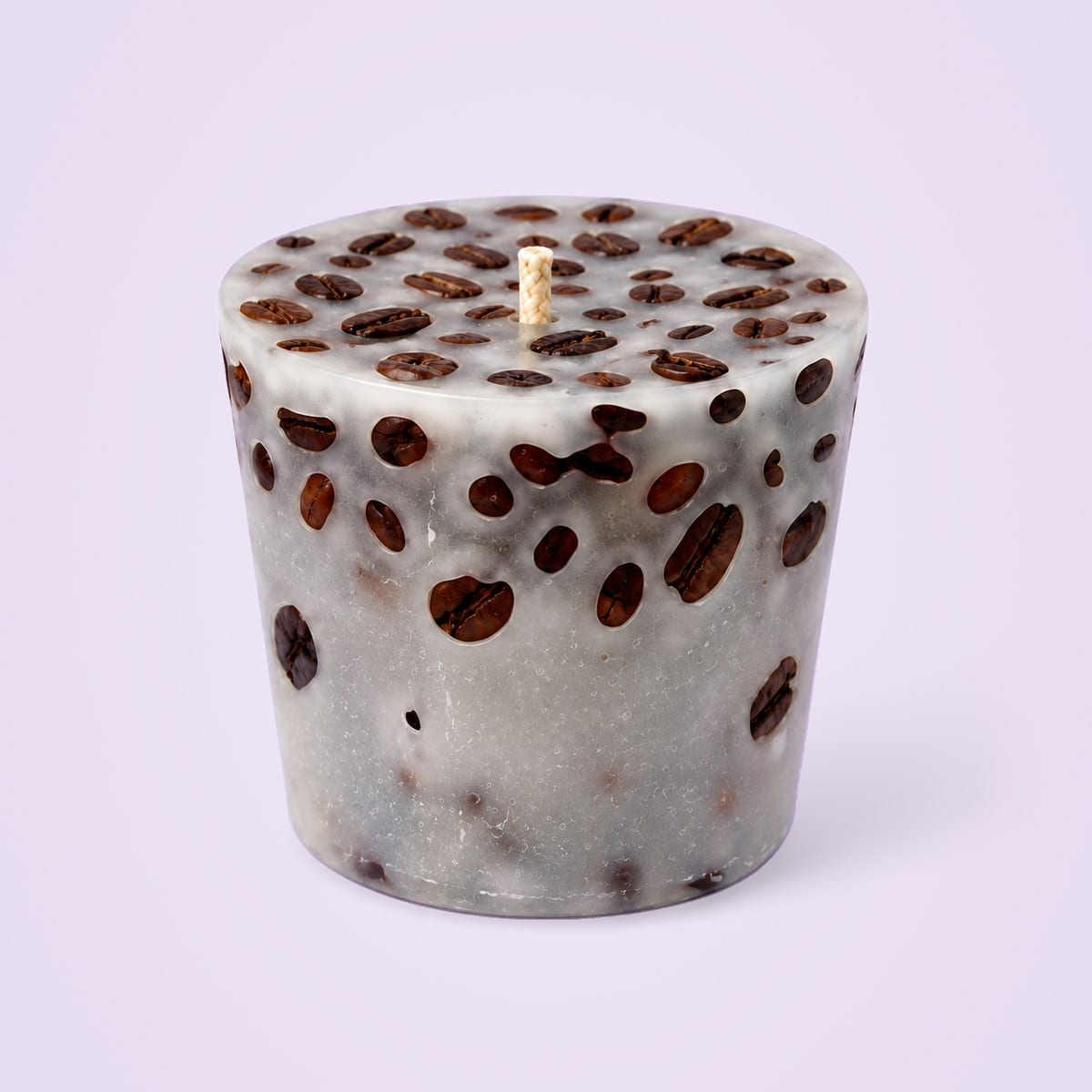 Off-white coffee bean cup candle in translucent grey-white wax, wider at the top