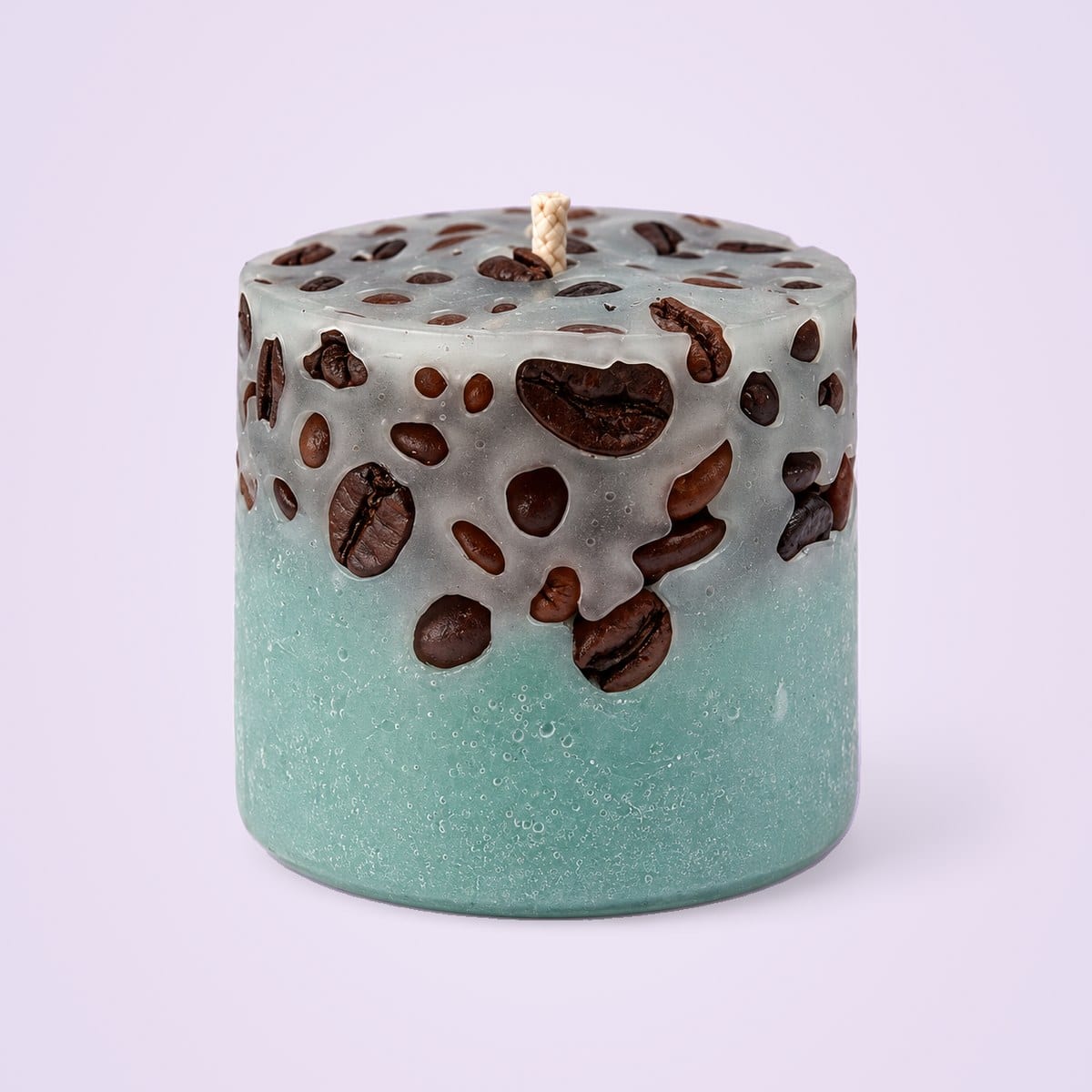 Light green coffee bean cup candle, with coffee beans set in translucent grey wax on top