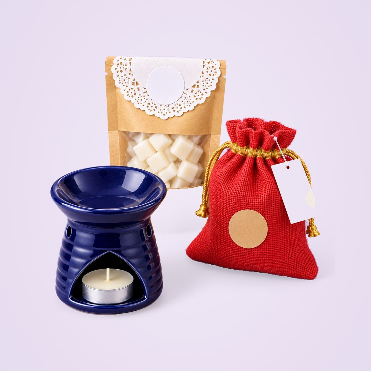 Diffuser and wax melt pouch beside a red potli bag