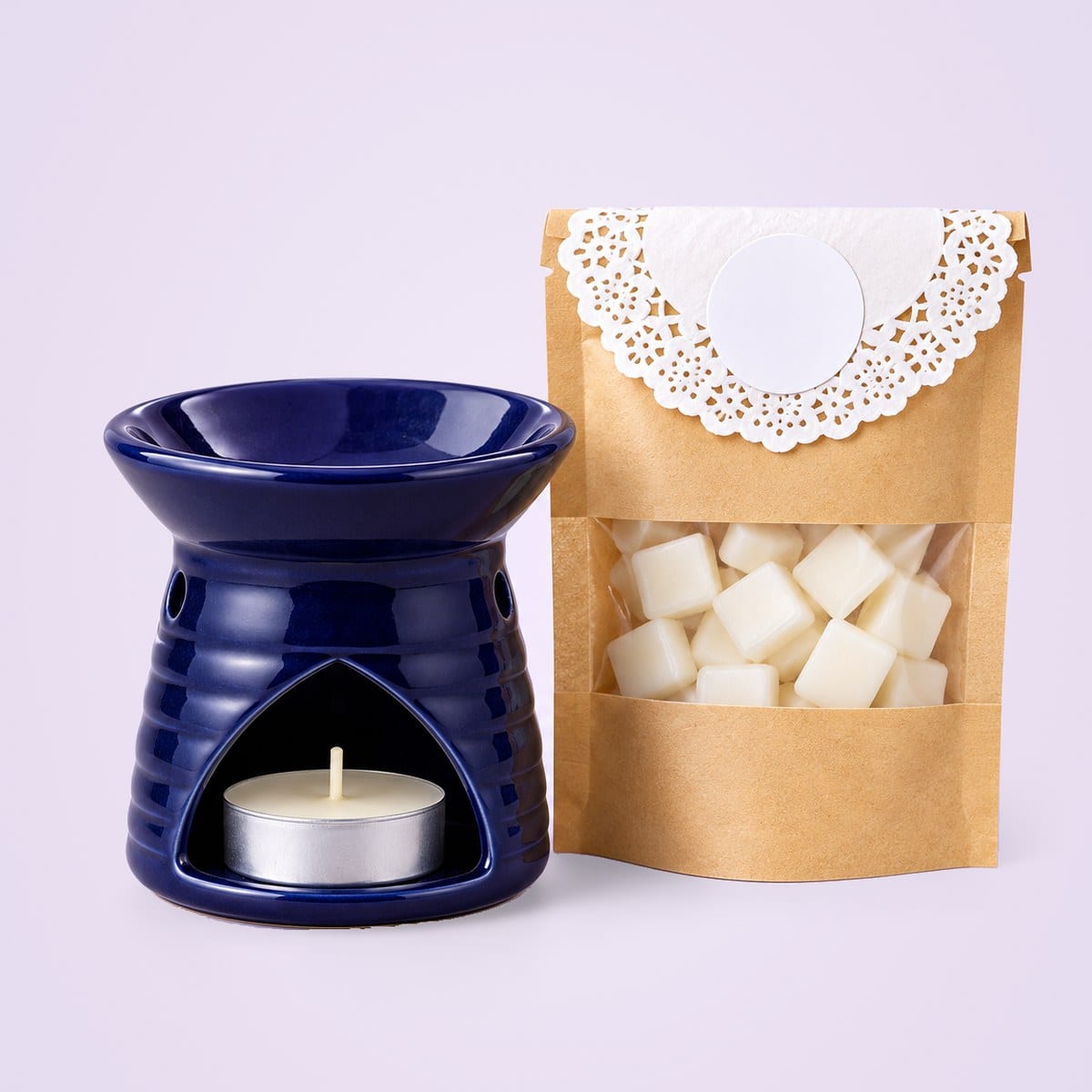 Navy ceramic diffuser with a wax melt pouch and a tealight