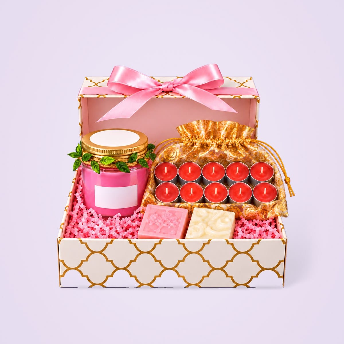 Gift hamper with a candle jar, ten tealights and two soaps in a pink box