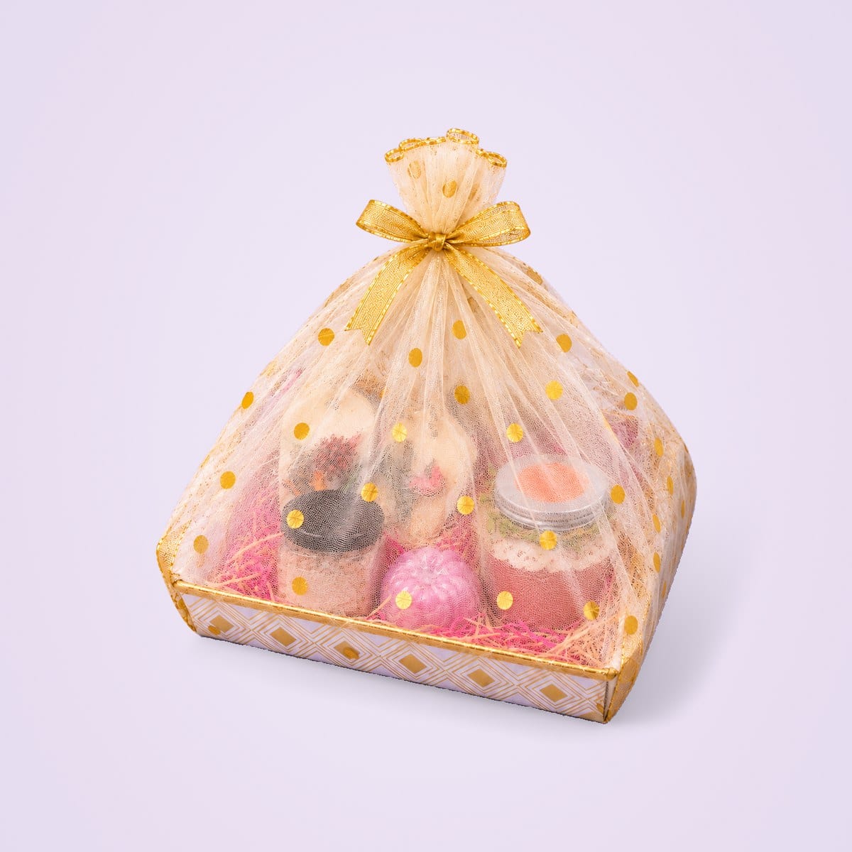 Gift Hamper 2 wrapped in organza and tied with a gold bow