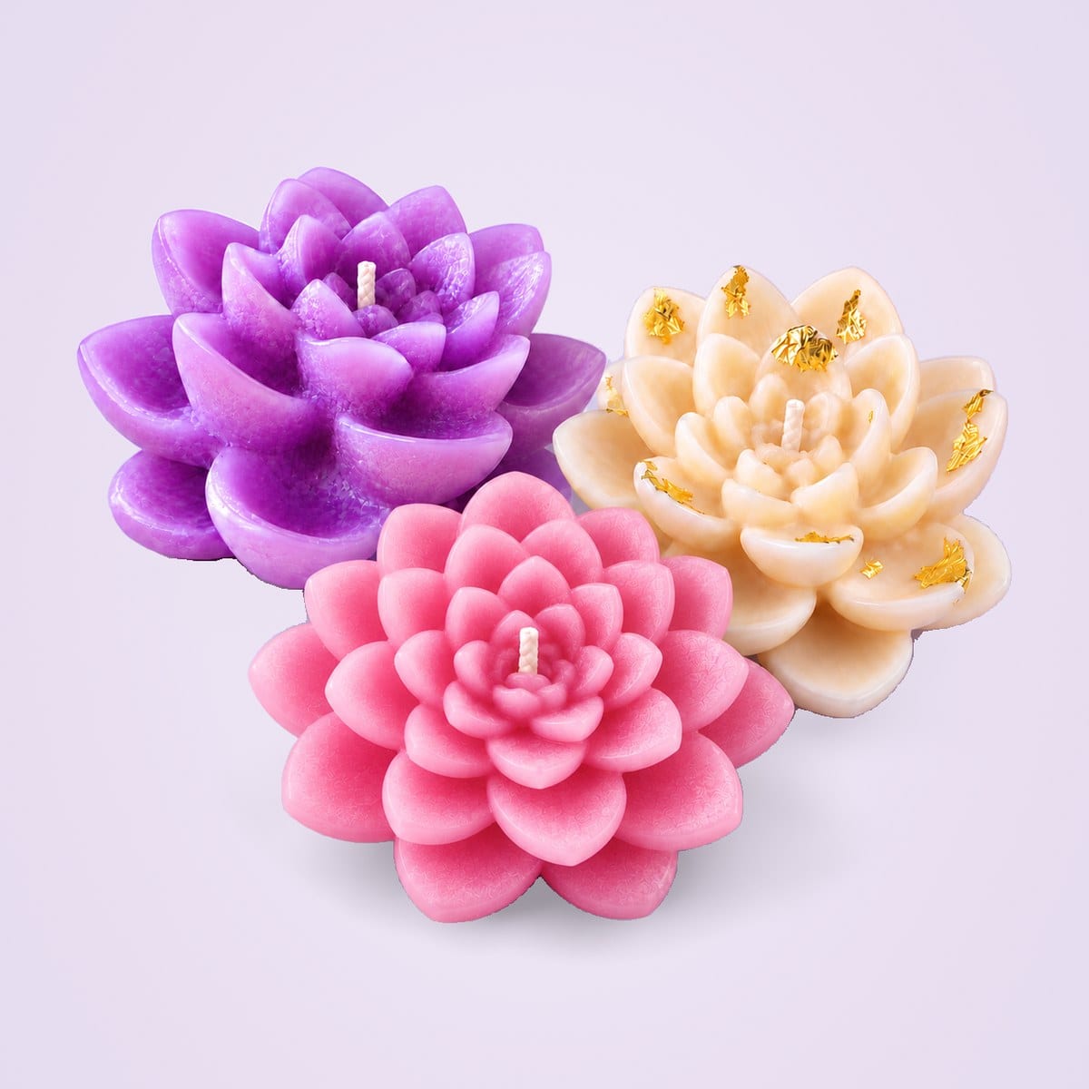 Lavender, pink, and ivory and gold lotus candles