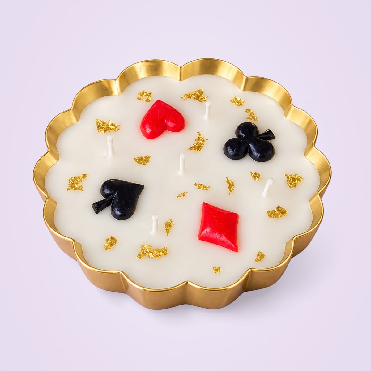 Card-suit urli candle with a red heart and diamond and a black spade and club in white wax