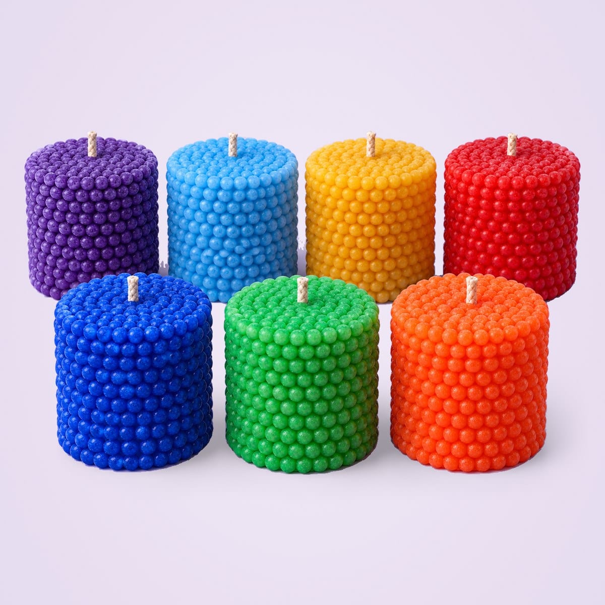 Pearl pillar candles in seven colours: violet, royal blue, sky blue, green, yellow, orange and red