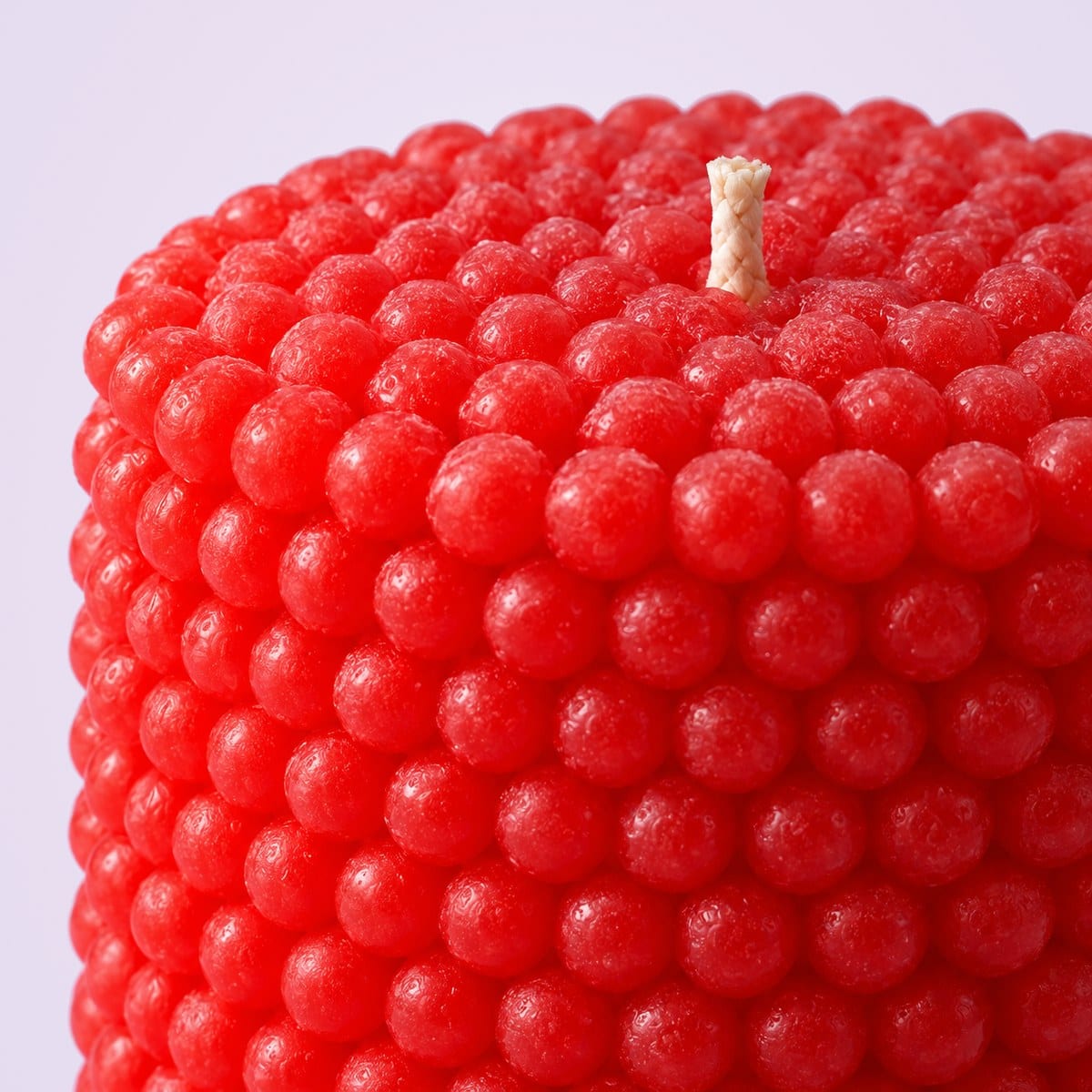 Close-up of the beaded top of a red pearl pillar