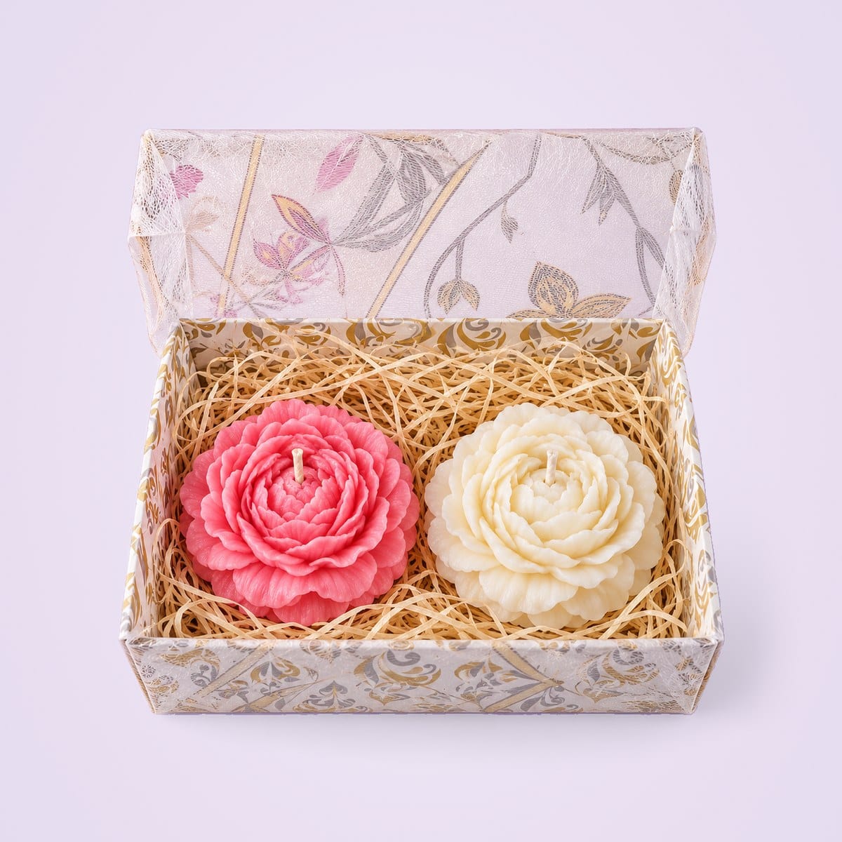 Pink and ivory peony candles in a clear floral gift box
