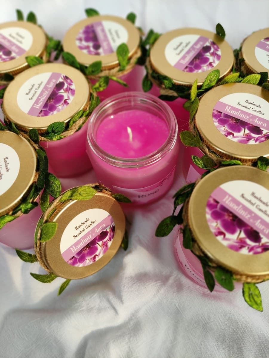Pink glass jar candles with decorated lids