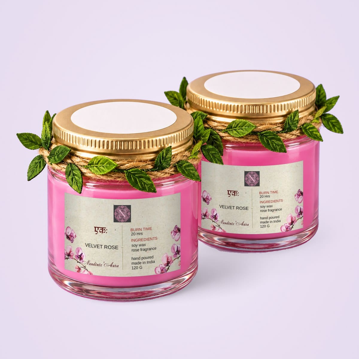Two pink glass jar candles
