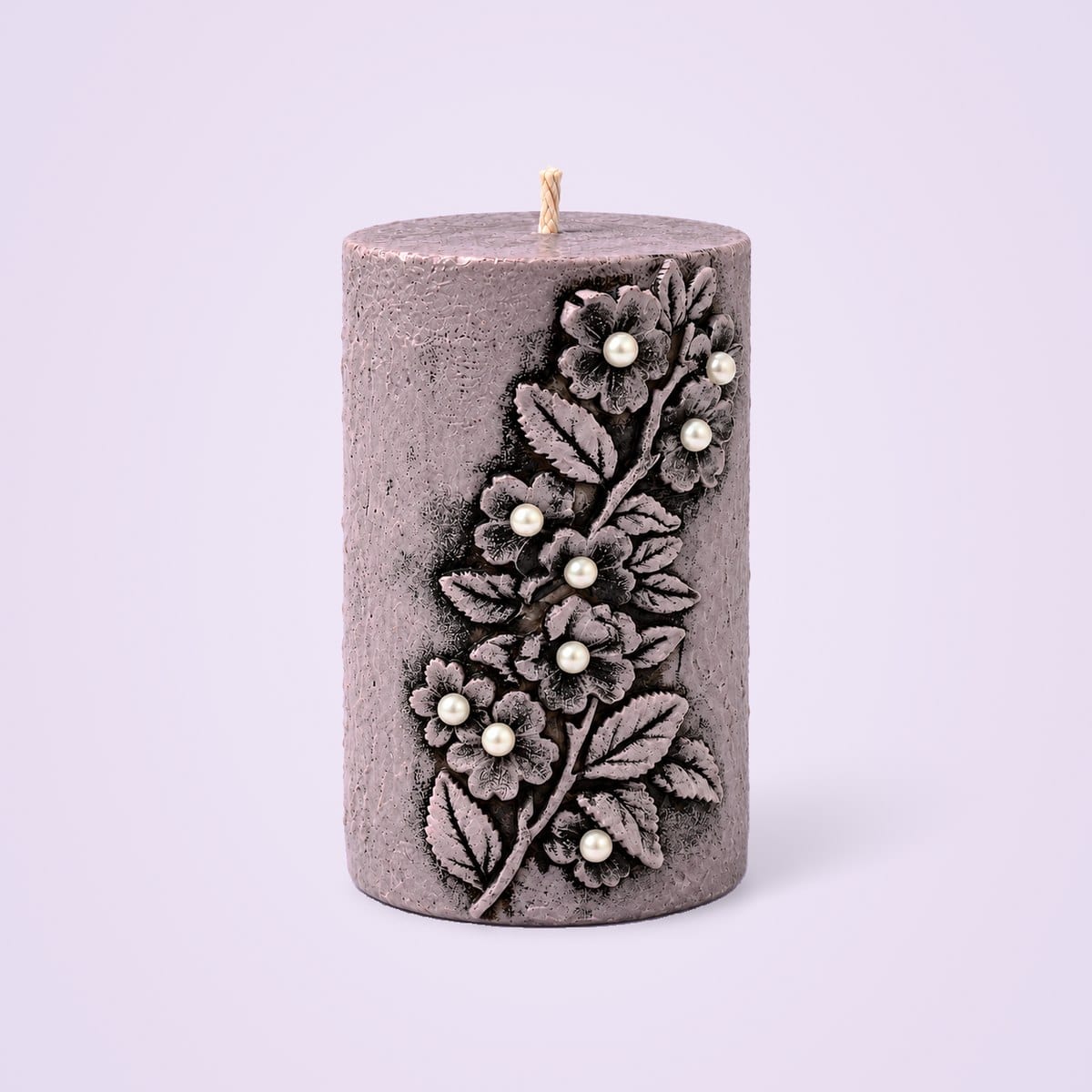 Mauve vintage pillar candle with floral relief and white pearls in the flower centres
