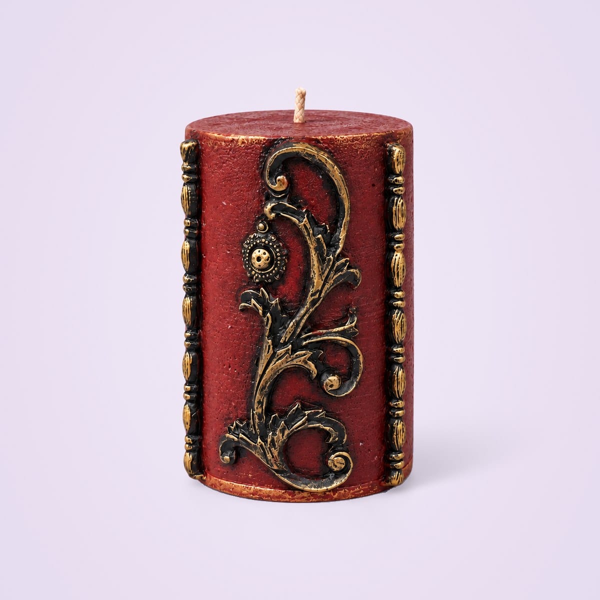 Maroon vintage pillar candle with gold scroll detailing