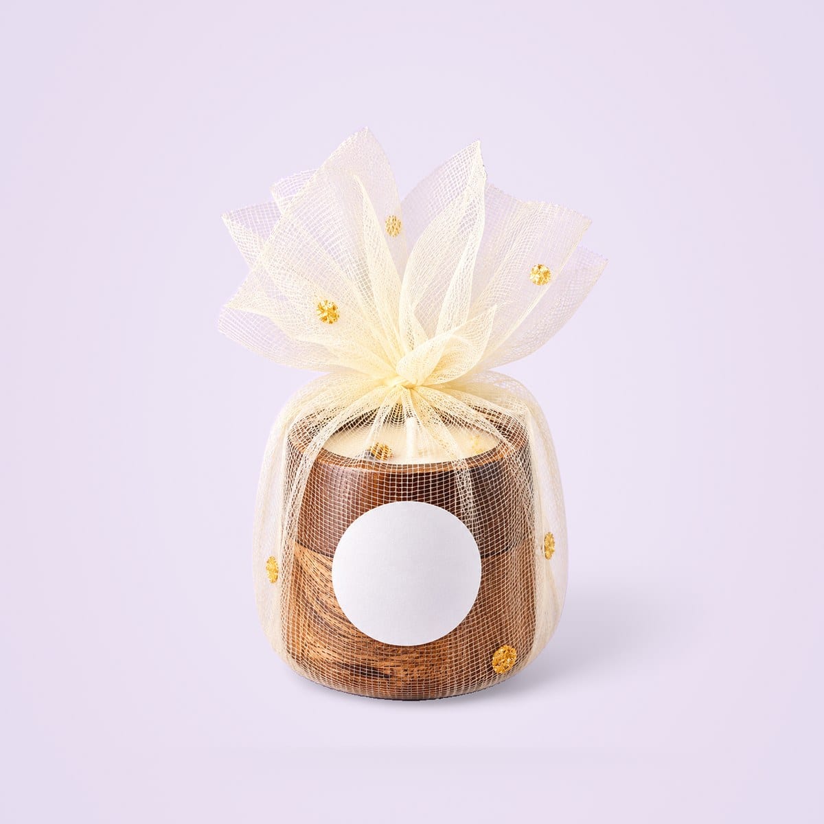 Wooden jar candle wrapped in cream organza